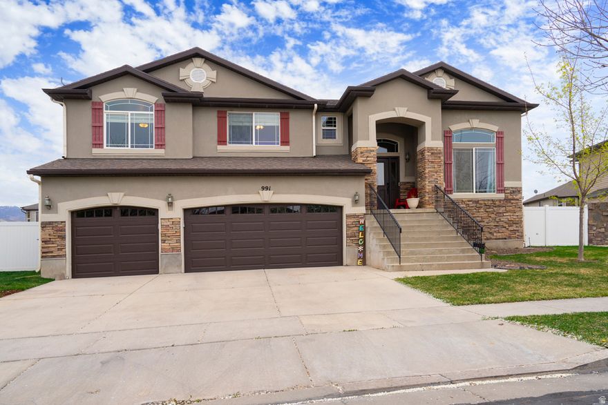 This is your chance to own one of the finest homes in the highly sought-after Foxboro community of North Salt Lake. From the moment you step inside, this home impresses with its bright, open floor plan and beautifully designed outdoor spaces. The spacious open-concept kitchen and family room are ideal for everyday living and entertaining, featuring granite countertops, a new gas stove, and a double oven. Step outside onto a stunning deck - an entertainer's dream and the perfect place to relax or host gatherings. The main level offers three generously sized bedrooms, including a spacious primary suite with an en-suite bath, plus two additional bedrooms and a full bath. Conveniently located laundry on this level adds to the home's functionality. Downstairs, you'll find a fully finished, apartment-style layout complete with a large family room, cozy fireplace, kitchen, and two additional bedrooms. A full walkout entrance provides flexibility for guests, multi-generational living, or rental potential. You'll also appreciate the rare 250 square feet of dedicated storage space on this level - a feature most homes simply don't offer. Need garage space? You're covered with an oversized three-car garage. The location is hard to beat, with a neighborhood park directly across the street and easy walkability to the Legacy Trail. This home truly has it all - but it must be seen to be fully appreciated. Schedule your showing today before this exceptional property is gone!  Buyer to verify all.