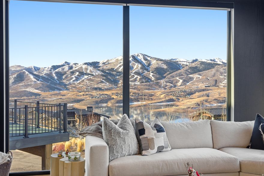 The views are truly breathtaking-no Photoshop needed. This nearly new mountain home feels instantly welcoming, warm, and filled with great energy. It's the kind of place you genuinely enjoy being home. At the heart of the home is a true chef's kitchen, thoughtfully designed for serious cooking and entertaining. Featuring Sub-Zero and Wolf appliances, a wine refrigerator, and elegant finishes, it strikes the perfect balance between luxury and everyday livability. The main level offers exceptional functionality with a dedicated office and one of two primary suites, ideal for single-level living or hosting guests. Upstairs, a cozy family room or den creates a secondary gathering space, complemented by three additional bedrooms and three bathrooms, all designed for comfort and privacy. Each bedroom includes its own ensuite bath. Indoor-outdoor living shines with three separate patios and decks, providing multiple spaces to relax, entertain, and take in the surrounding mountain scenery. Backing to open space with direct trail access, the setting is peaceful and private-perfect for morning walks or taking the dog out. Oversized picture windows frame sweeping mountain views, while wood-clad vaulted ceilings, wide-plank white oak floors, a whole-house sound system, heated bathroom floors, and spa-like soaking tubs elevate the home throughout. Located in the desirable Soaring Hawk community, the home is just minutes from Park City, Historic Main Street, world-class skiing, the expanded Deer Valley East Village, and year-round recreation at Jordanelle Reservoir. This is mountain living at its finest-where comfort, beauty, and lifestyle come together seamlessly.