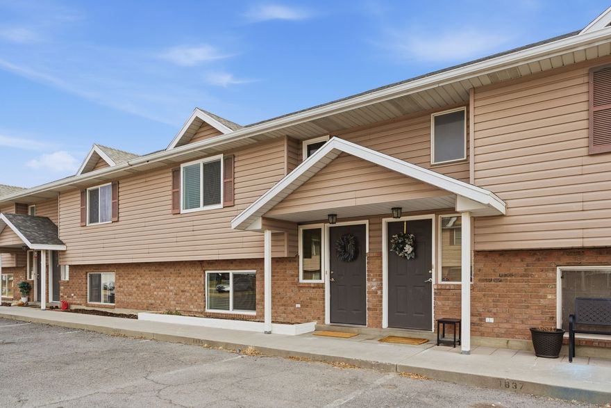 As close to single family living as it gets! One of the only townhomes with an HOA under $100/month and a private fenced backyard! This home checks all the boxes for a starter home at the most affordable price! NEW water heater (2025), NEW windows (2024), and NEW furnace (2023) will give you peace of mind for years to come. Custom built-in shelving in the living room and closets, accent walls, and wood-look tile give this updated home both style and function. Smart home features include a Nest thermostat, Ring doorbell, and SimpliSafe security system.   In the private backyard, enjoy an established and maintained raspberry bush, strawberry patch, and garden beds. For more outdoor space, enjoy close to a quarter acre of communal HOA space with trees and playground equipment. The small HOA of just four homes gives you all the HOA perks without the drawbacks.