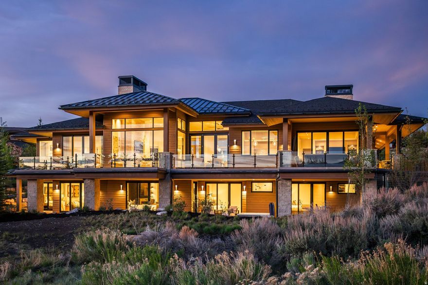 Welcome to 2647 Silver Berry Court, a contemporary mountain retreat completed in 2024 in Promontory Club, one of Park City's premier gated golf communities. Designed by Mark Walker of Otto Walker Architects and built by Knight Construction, this exceptional residence blends clean modern architecture with warm organic finishes and seamless indoor-outdoor living. Expansive gathering spaces open to heated patio decks and outdoor dining areas, creating the perfect setting for year-round entertaining. The thoughtful floor plan balances privacy and functionality with an upper-level primary suite and office featuring expansive views, while the lower level includes four guest bedrooms and a dedicated fitness room. Radiant heat extends throughout the home, including the driveway, garage and outdoor living spaces, along with thoughtful additions such as a heated dog run and oversized dog wash. Inside, designer finishes and layered textures create a timeless, elevated feel, complemented by Hammerton, Kelly Wearstler, Arteriors and Palecek fixtures, Phillip Jeffries wallcoverings, Lutron lighting and shades, Crestron AV, and central vacuum. Offering a refined yet relaxed lifestyle in the heart of Promontory, this home captures the very best of modern mountain living. Ideally located just minutes from Park City and Deer Valley, approximately 20 minutes to Heber Valley Airport and 35 minutes to Salt Lake International Airport, the residence offers exceptional convenience with easy access to world-class skiing, dining, golf and year-round recreation.