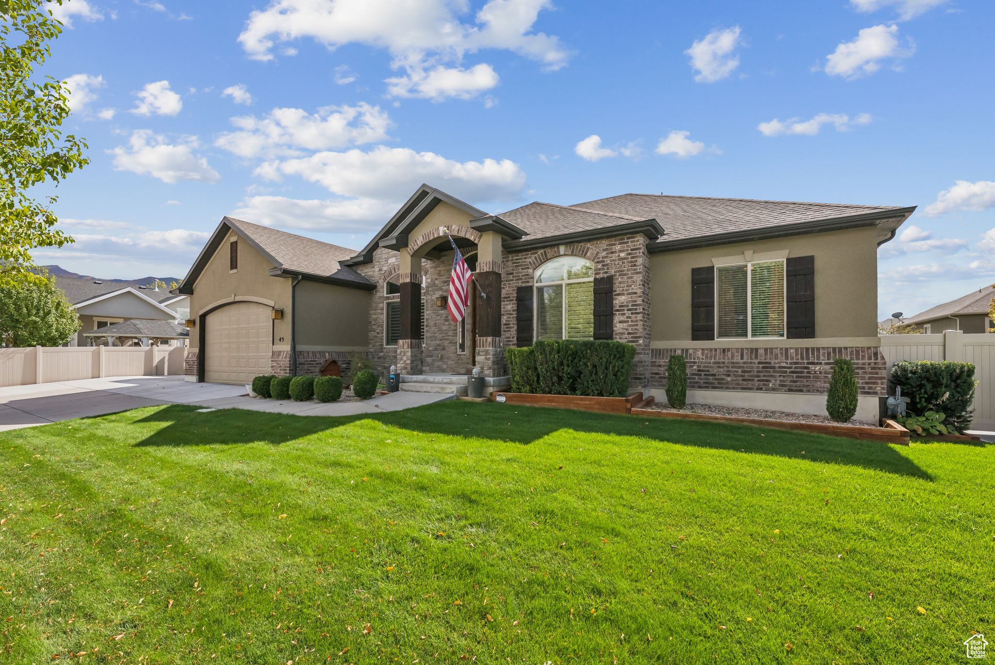 This beautiful 6-bedroom Stansbury Park rambler truly has it all! From its amazing location to the countless upgrades, this home is designed for comfort and style. Features include shutters, granite countertops, stainless steel appliances, knotty alder cabinets, a custom hood, vaulted ceilings, 2 gas fireplaces, and a spacious 4-car garage with a 9' door. Step outside to enjoy the brand-new Trex patio and included hot tub, perfect for entertaining or relaxing year-round. Inside, the basement offers 9' ceilings, 2 family rooms, a full home gym (included with the home), an additional master suite with full bath, and it's already pre-plumbed for a kitchenette. Don't miss your chance to own this stunning home-schedule your showing today!