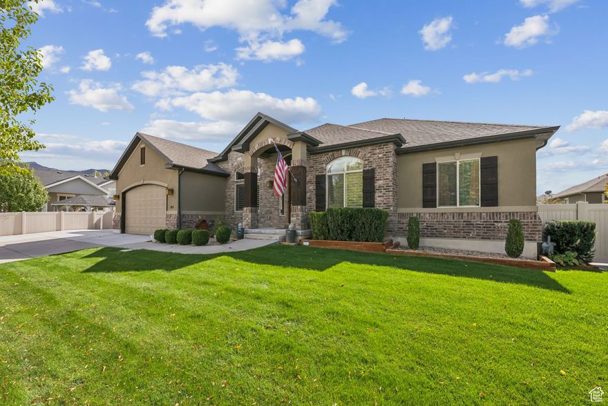This beautiful 6-bedroom Stansbury Park rambler truly has it all! From its amazing location to the countless upgrades, this home is designed for comfort and style. Features include shutters, granite countertops, stainless steel appliances, knotty alder cabinets, a custom hood, vaulted ceilings, 2 gas fireplaces, and a spacious 4-car garage with a 9' door. Step outside to enjoy the brand-new Trex patio and included hot tub, perfect for entertaining or relaxing year-round. Inside, the basement offers 9' ceilings, 2 family rooms, a full home gym (included with the home), an additional master suite with full bath, and it's already pre-plumbed for a kitchenette. Don't miss your chance to own this stunning home-schedule your showing today!