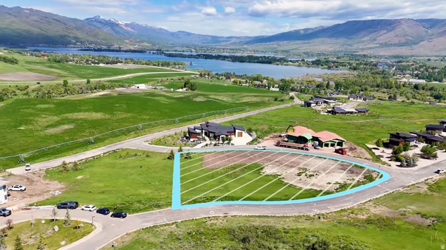 Build-ready 1.1-acre homesite in the desirable Trappers Crossing community in Huntsville. This premium mountain lot offers full utilities at the property line-including water, sewer, power, and fiber-providing a smoother and more cost-efficient path to future construction. Located minutes from Powder Mountain, Snowbasin Resort, and Pineview Reservoir, the property sits in one of Utah's strongest four-season recreation corridors. The gently sloped terrain supports multiple build configurations and captures views of the surrounding Ogden Valley. Convenient access to Ogden, Salt Lake City International Airport, and Park City adds to long-term appeal. Buyer to verify all information, including utilities, connection fees, and building requirements