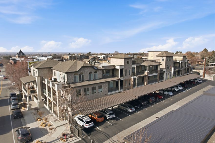 Experience everything Holladay has to offer with residence #A202 at the Terraces of Holladay, an exclusive gate community in the heart of Holladay. This two bedroom, two bath condo has an open floor plan with a beautiful kitchen featuring quartz countertops and KitchenAid stainless steel appliances, a separate dining area and a living room with custom wine bar. Retreat to your primary suite that boasts a private deck plus en suite bath including separate tub and shower, dual vanity and walk-in closet. Enjoy an evening with friends on the rooftop deck with amazing panoramic views, BBQ, fire pit, pergola and plenty of seating. Includes one garage space(#50) with a storage closet for your gear. Just steps to Holladay Village including Harmons, shops and restaurants and a short drive to Holladay Hills, freeway, canyons and more. Secure gated community with elevator. Pet friendly HOA. Easy to show, call for your appointment today. Buyer to verify all.