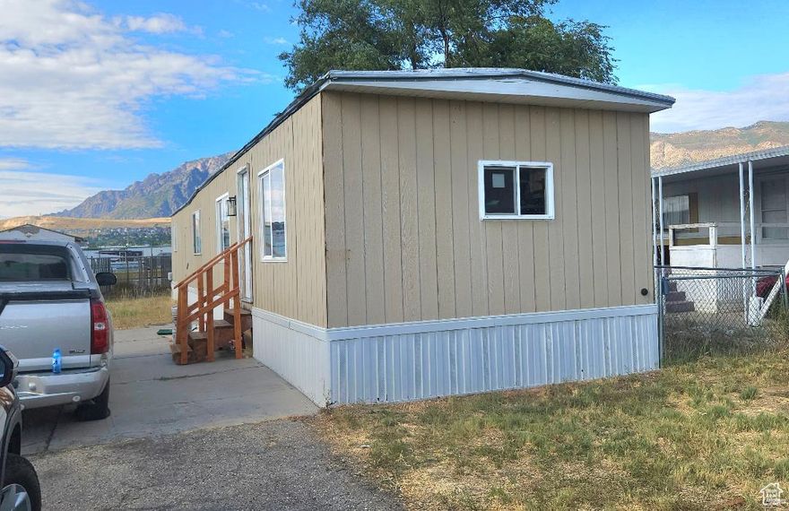 Gorgeous remodeled 2 bed, 1 bath mobile home priced to sell at just $20,500! This beautifully updated home features stylish finishes, a built-in electric fireplace, and all appliances are included in the sale. Seller is also willing to include a portable A/C unit upon request. Please note: a few cabinet doors are missing and will need to be custom cut from wood to fit, and some backsplash pieces are not glued on-remaining pieces are on the counter by the sink. You don't want to miss this opportunity to own a move-in ready home at an incredible price. Seller is motivated-bring your offers! Square footage is approximate; buyer to verify.