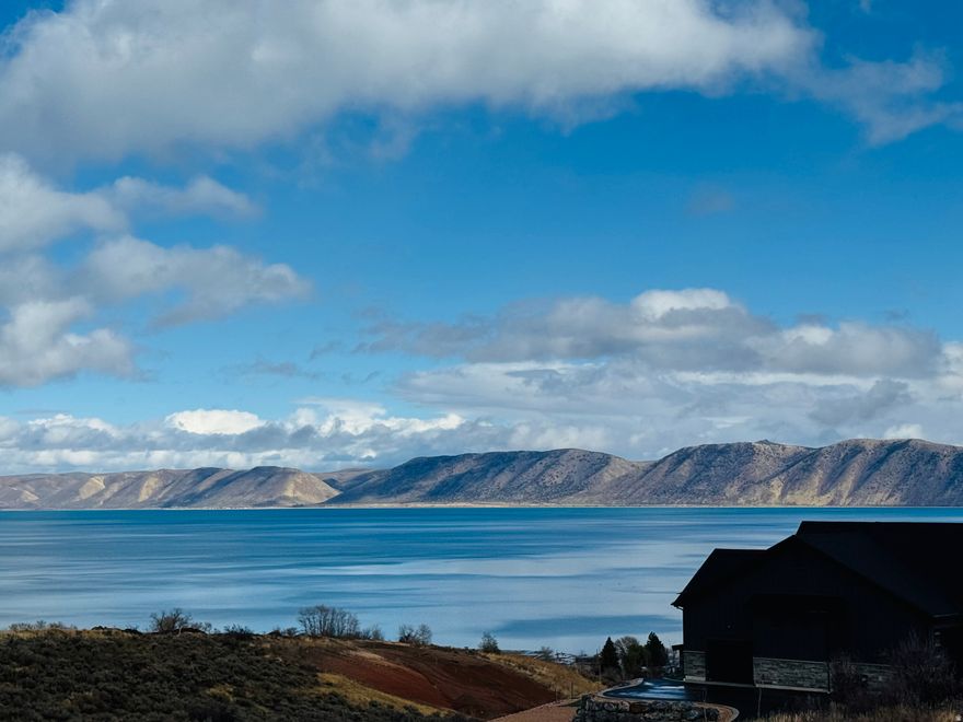 Discover the perfect place to build your dream home on this spacious building lot offering stunning lake views and easy access to miles of scenic trails. Nestled in a peaceful, well-maintained community of Long Ridge , this property combines the serenity of nature with the convenience of modern living.  Enjoy paved roads for year-round access, gently rolling terrain ideal for construction and everyday living. Step outside your door to explore nearby hiking, biking, and ATV trails, or relax and take in the breathtaking sunsets over the water.  Whether you're planning a full-time residence, a vacation retreat, or an investment property, this lot is perfect for all 3. All utilities stubbed to the lot, making it ready for your custom build.  Experience the best of lake living-views, space, and adventure-all in one incredible location.