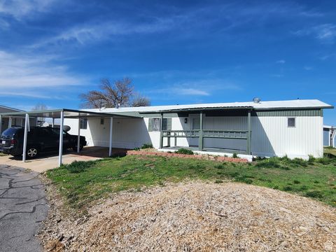 Photo of 2600 N HILL FIELD RD #108, Layton, UT 84041 (MLS # 2126934)