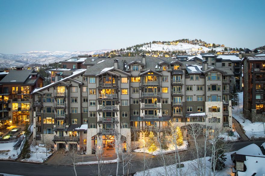 Top of the building. Top of the mountain. Top of Empire Pass. This rare top-floor, end-unit penthouse at Silver Strike Lodge represents the most coveted configuration in one of Deer Valley's most exclusive addresses-where opportunities of this caliber have become increasingly difficult to find.  Vaulted ceilings with hand-crafted beams crown a residence that lives larger than its footprint, capturing unobstructed views of Empire Canyon, Lady Morgan, and the Wasatch from every window. Taken to the studs and reimagined by Alder & Tweed in 2014/15, then curated again in 2020/21, this was no surface remodel. A wall was removed at entry to maximize the panorama. The great room fireplace was recessed 16 inches and refinished in its original stone. The primary suite ceiling was raised and coffered. The primary bath was rebuilt as a spa sanctuary anchored by a statement stone soaking tub and designer steam shower.  The details are bespoke throughout: underlit onyx countertops on the island and dry bar, distressed European wood flooring imported from Belgium, leather wall tiles in the mudroom, custom millwork in every room, and a bunk room finished with a hand-painted American flag ceiling. The chef's kitchen carries new high-end appliances, copper sink, wine cabinet, and statement onyx surfaces.  In 13-plus years of ownership the residence has never been rented and has averaged only two weeks of personal use per year. It shows accordingly-turnkey, fully furnished, and barely lived in.  The Silver Strike Express Chairlift sits steps from the lodge's private ski room, with on-site amenities including a ski butler, aprs lounge, fitness center, hot tub, firepit, shuttle service, and assigned parking. A FULL TALISKER CLUB MEMBERSHIP is available for separate purchase (buyer must apply and be accepted), unlocking The Tower Club at Empire Pass, Tuhaye golf above the Jordanelle, Courchevel Bistro and the private Main Street lounge, and The Outpost backcountry retreat.  This is the residence Empire Pass buyers wait for. They rarely wait long.