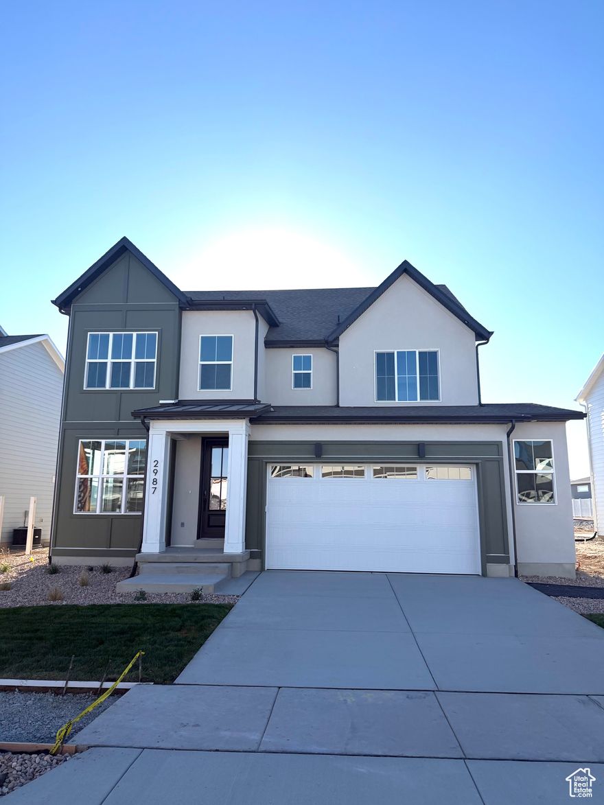 The Northstar is a grand two-story home offering modern luxury and versatility, perfect for families needing extra space. The main floor features a sprawling open-concept layout seamlessly connecting the kitchen, dining area, living room, and a spacious patio, complemented by a large mudroom off the garage for added storage. Upstairs, four spacious bedrooms, each with a walk-in closet, provide private retreats, including a tranquil primary suite with a lavish ensuite bathroom. Premium finishes and thoughtful details throughout make the Northstar the pinnacle of modern living.