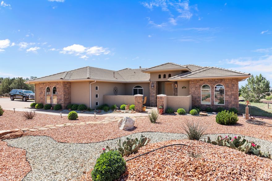 Welcome to easy living in this charming 4-bedroom, 2-bath single-family home nestled on a spacious corner lot in the heart of Apple Valley, Utah. Surrounded by stunning red rock views and set on nearly an acre this home offers the perfect blend of comfort, space, and tranquility. With a thoughtful no-step entry design, this home is ideal for anyone seeking single-level living in a quiet, slower-paced community. You'll love the expansive RV parking area, complete with water and power hookups-perfect for guests, toys, or your own desert getaway setup. Whether you're soaking in the scenic surroundings, enjoying the peaceful lifestyle, or simply relaxing on your property under clear skies, this home is rare find in one of southern Utah's most serene settings. No HOA, no hassle-just freedom and fresh air.