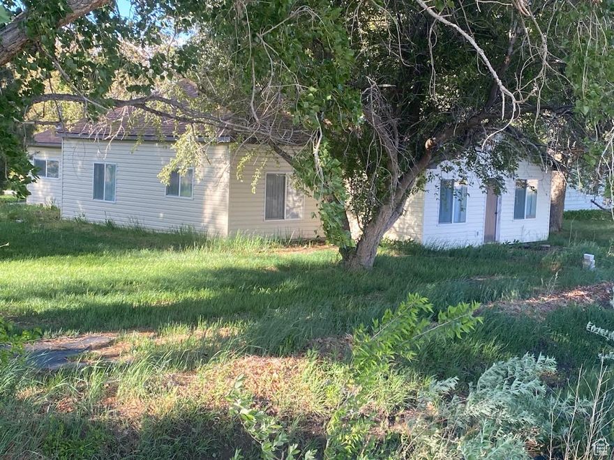 A beautiful home on a beautiful, shady corner lot!  3 bedrooms, 1 bath all on one level! City Water plus secondary water.  Please ask us for details on the secondary water.  Lots of mature trees! Lots of grassy lawn!  Quiet and private.  Heat pump plus a woodstove.  Even heated floors!!!  Vacant and easy to show!   This is an estate sale.  Property to be sold "as is, where is."  Easy to find.