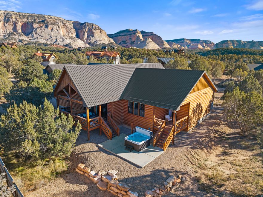 Located in the picturesque Quarter Circle H Ranch subdivision in Orderville, UT. This property offers stunning views of the pink coral cliffs. Built in 2023, the .68-acre lot features a main home with 2,460 sq. ft, 4 bedrooms, 3 bathrooms, and a 3-car garage. The main home includes a primary suite, junior suite, tile showers, T&G ceilings, gas fireplace, and a hot tub. Both the main home and the guest house are currently short-term vacation rentals and have good rental history. Each home can be rented separately maximizing potential rental income. Situated perfectly between Zion and Bryce. Just 20 minutes from the new east side Zion Visitor Center currently being built, 2 hours from the North rim of the Grand Canyon ad 1.5 hours from Lake Powell. Perfect place to explore all of Southern Utah. This property comes fully furnished, making it a turnkey operation with great investment potential. You can rent both homes, live in one and rent out the other, or enjoy it as a full-time residence. Buyer to verify all.