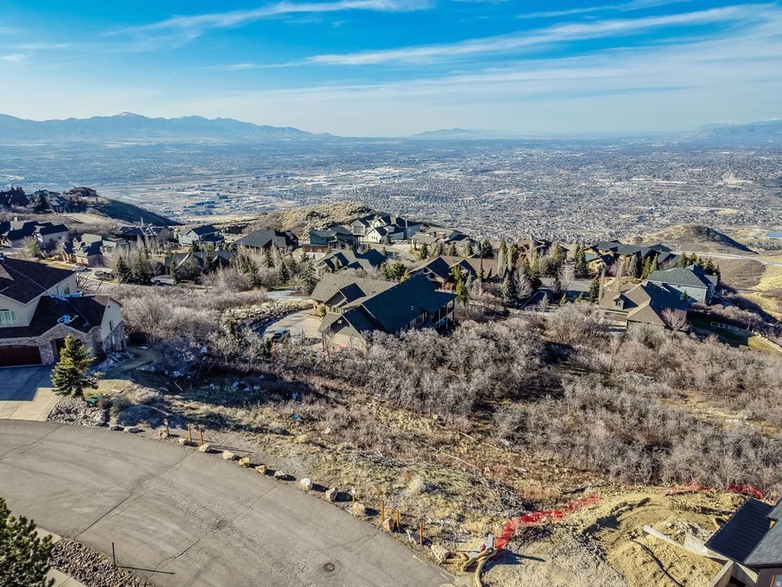 Build your dream home on this exceptional lot in Draper (Suncrest) with spectacular views. HOA-approved home plans are available and ready to build, making it easy to get started, but using those plans is completely optional. Buyers may bring their own builder and custom plans, subject to HOA approval. Geotechnical report is also available upon request. This is a rare opportunity to create a custom home in one of Draper's most desirable communities.