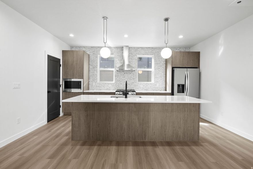 Expected completion beginning of May - Modern living meets convenience at theMONROE townhomes, ideally located in the heart of South Salt Lake with quick access to downtown, shopping, dining, and major commuter routes. This thoughtfully designed home features an open-concept layout with a spacious kitchen, dining, and living area-perfect for both everyday living and entertaining. Offering 3 bedrooms, 3 bathrooms, and a 2-car garage, this multi-level floorplan provides functional living with a private primary suite and well-separated secondary bedrooms. Contemporary finishes throughout include quartz countertops, sleek cabinetry, and modern lighting selections that create a clean, elevated aesthetic. Enjoy low-maintenance living in a growing community with amenities including a pickleball court and nearby green space. Whether you're looking for a primary residence or a lock-and-leave lifestyle close to the city, theMONROE offers the perfect blend of style, function, and location.