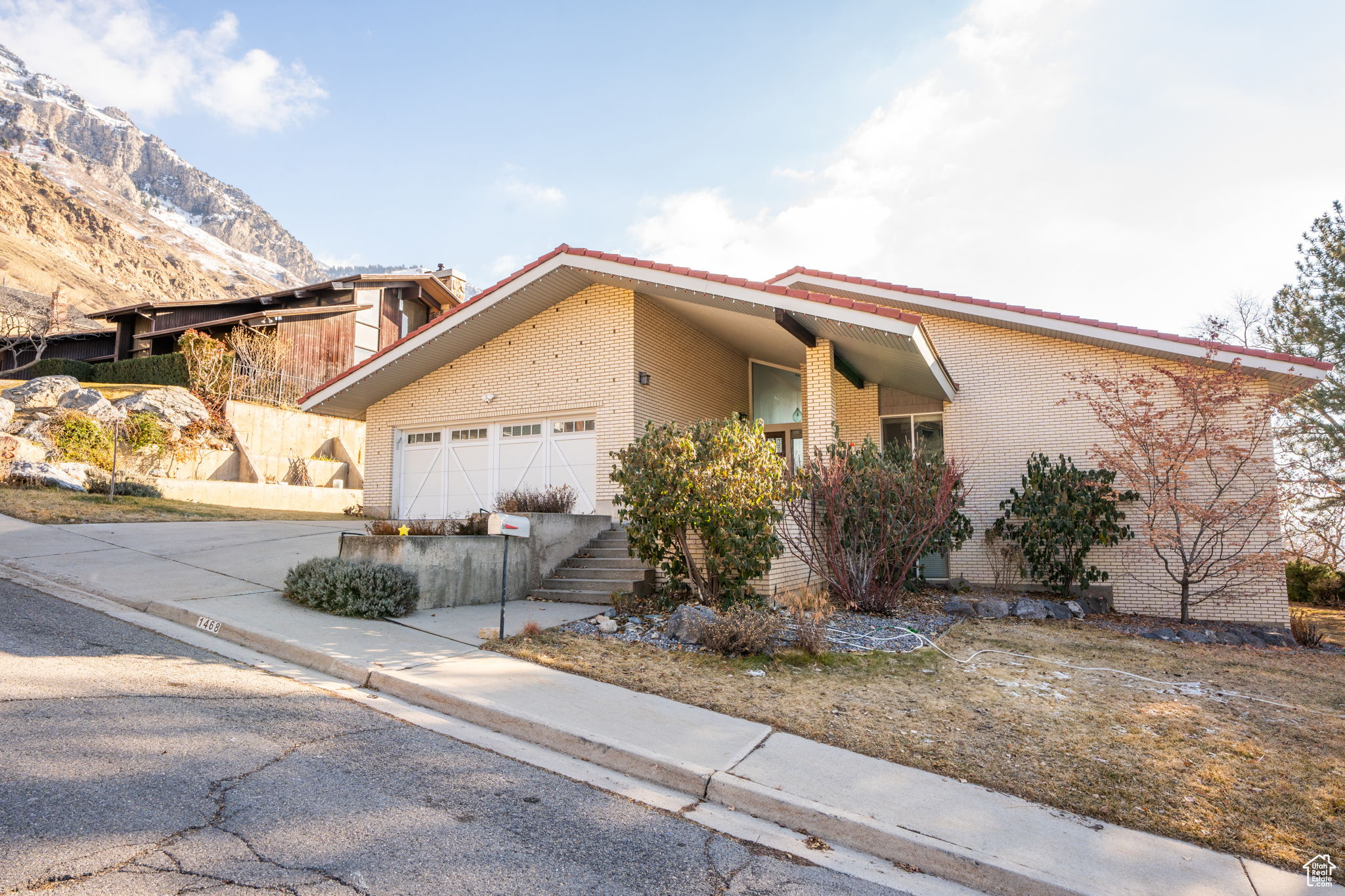 Located in the popular Oak Hills East Provo Neighborhood only minutes from BYU, Wasatch Chinese Immersion Elementary School and Rock Canyon, this stylish mid-century home with incredible views is up for sale.  Home features main floor living with large great room, vaulted ceilings, grand fireplace and floor to ceiling windows.   Master suite and 1 additional bedroom on main floor along with large dining space and cozy den with build-in bookshelves.   Walkout basement has large family room, ample storage and 2 additional bedrooms.   Home has wrap around decks, mature trees and flat grassy space to enjoy. Lots of upgrades including real hardwood flooring,  high-end light fixtures and newer windows to take in the stunning views.