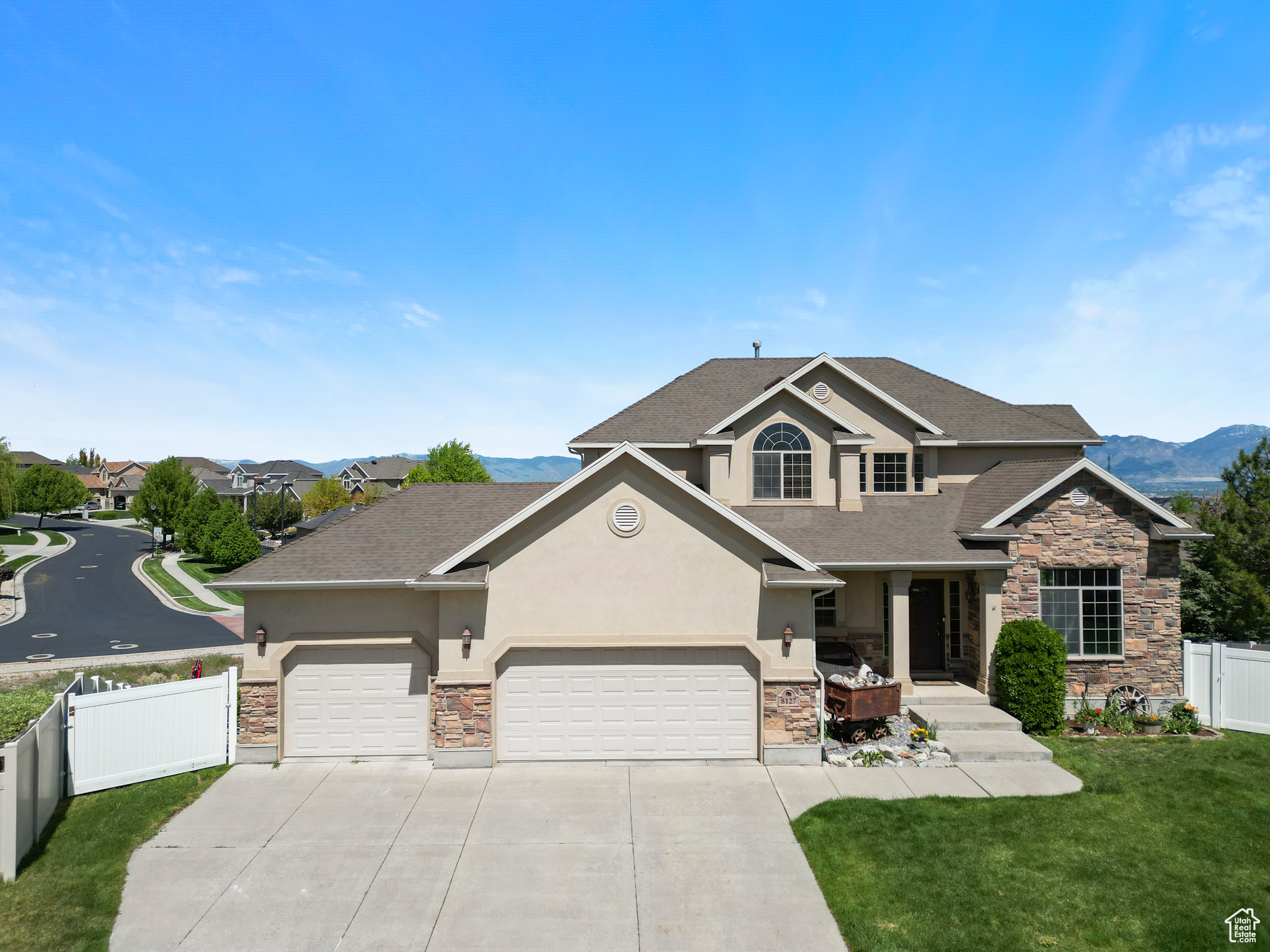 **This property to be featured on Utah's Real Estate Essentials on ABC4!** Located just 5 minutes from convenient restaurants and shopping, this beautifully maintained home offers stunning views of the Wasatch Mountains - best enjoyed from the expansive deck or while relaxing in the private hot tub. The spacious yard is perfect for outdoor gatherings or gardening, while inside, the kitchen features high-end cabinetry and finishes that will be enjoyed thanks to a functional layout. Bedrooms in the home are spacious including the primary suite with its grand double doors and ample vanity space. Downstairs, the fully finished walkout basement is built for entertaining thanks to a wet bar, built-in speakers, and open space for games or movie nights. A large garage and basement workshop space completes this incredible home. Don't miss your chance to own this gem on the end of the cul-de-sac, with no backyard neighbors.  This is the property everyone dreams to own.