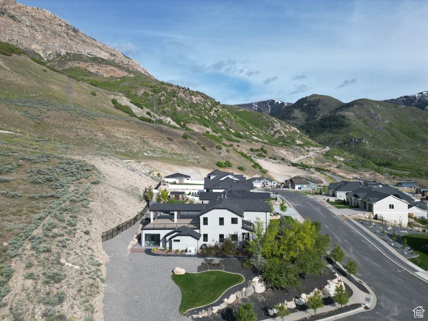 Welcome to your dream retreat. Nestled at the base of the North Ogden Divide, this extraordinary home offers a perfect blend of luxury, comfort and an unbeatable location. Featuring 3 bedrooms, 4 bathrooms and killer 360 degree views. Imagine hosting while being able to swim year round in your private indoor pool, complete with expansive sliding glass doors all around to bring in the natural light and stunning views of the surrounding mountains. The primary suite is a luxurious retreat with a spa-like en-suite bathroom, walk-in closet and private balcony overlooking the valley.  Just minutes away from many ski resorts, hiking and biking trails, and outdoor adventures while still close to shopping, dining and top-rated schools.  This unique property combines the best of indoor and outdoor living in one of Northern Utah's most desirable locations. Whether you're hosting a pool party, enjoying quiet morning on your patio or exploring the mountains, this home truly has it all. Don't miss this rare opportunity. Schedule your private showing today and make this incredible house your forever home.