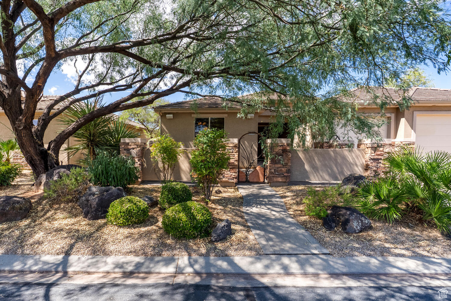 Well-kept home right on the golf course with red mountain views! Perfectly positioned on the fairway, this home has a large patio for outdoor entertaining, and spacious, inviting floorplan with 3 bedrooms plus an office. Open concept kitchen and living area with fireplace, high ceilings, and large windows to let in lots of natural light. Rooms are generously sized, including a third bedroom with an outdoor entrance making it perfect for a guest suite. Unique in this community, this home has a 3-car garage PLUS an outdoor parking area for small RV or outdoor toys. Lots of extras to make your life comfortable--extra storage throughout, built-in closet storage, large walk-in closet, and patio roller shades. And no need to worry about landscaping!! HOA takes care of it all!