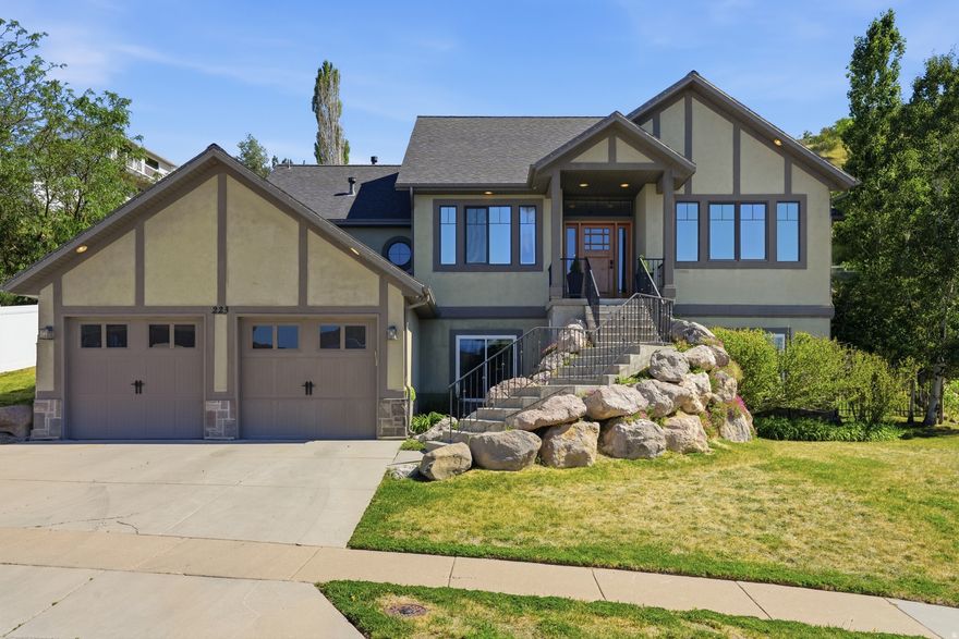 With sunrises in your backyard and the best sunset views from your front porch, life feels pretty good at 223 E 2050 N!    This gorgeous home is looking for its next family to make beautiful memories.   The views are outstanding here whether you're gazing out your backyard kitchen window to view the Wasatch mountains in your backyard,  enjoying the view from your primary bathroom or watching a sunset on the front porch. The views are unforgettable!  This home has been loved and the seller has done many upgrades so all you need to do is move in and enjoy!  Just a few include:  NEW HVAC System, NEW A/C condensers, NEW Smart Thermostats, NEW Everlights Permanent outside holiday lights, NEW Smart Door entry, NEW remodeled Primary bedroom (gorgeous), NEW Bespoke Refrigerator & Freezer, the list goes on!  You feel like you're far away from downtown Salt Lake City however close enough with your 20 minute commute. Oh and don't forget the 10 minute drive to the Farmington Station for great shopping and restaurants.  Come take a look and fall in love!!