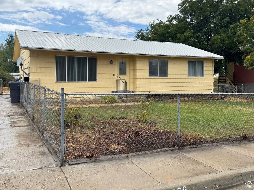 If you are looking for an affordable home to make your own, you have found it!  This cute Rambler has 3 bedrooms and 2 bathrooms.   The Lifetime metal roof was installed in 2010.  Newer Furnace and Central Air conditioner.  Water Heater is 1 year old.  Carport is included.   Enjoy your fully fenced yard for BBQ's, games and just relaxing.  Minutes away from fishing, hiking and camping.