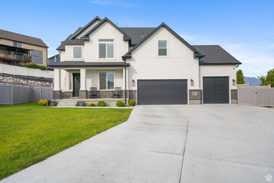 **Accepted offer with 48-hour time clause-still actively showing and accepting backup offers. If buyer #1 cannot perform, your offer could move into first position quickly. Contact for details and to schedule your showing.**  Spacious 5-bedroom, 3.5-bathroom home with den and 3-car garage. This property features a large yard ideal for entertaining, a hot tub, and beautiful views. The fully finished basement includes an additional living room with kitchenette, providing excellent space for guests or extended living. Interior highlights include dual thermostats, water softener, and an air scrubber for improved air quality. Conveniently located near schools and shopping (new Target and shopping center coming soon), with quick access to I-15 in approximately 10 minutes. The piece of land on the East side of the home between the fence and the road is owned by the city of Lehi, but the new owner has an option to buy the land from the city to expand the backyard even more.