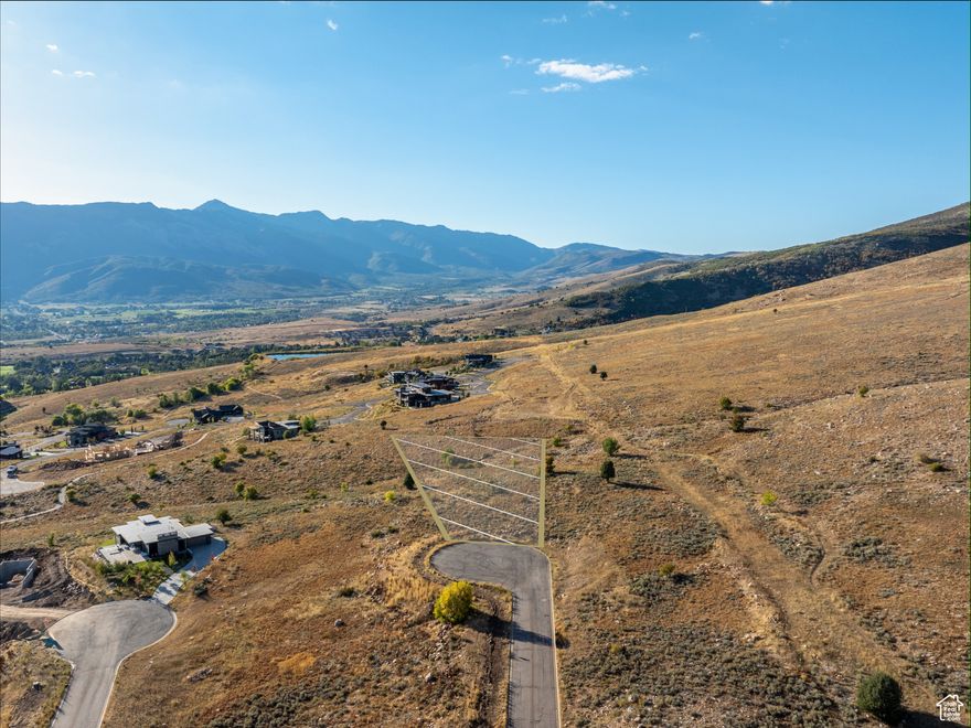 This South East-facing lot offers breathtaking views of Nordic Valley Ski Resort, Pineview Reservoir, and the stunning peaks that define Ogden Valley. The lot backs to preserved common space, providing an exceptional level of privacy and a direct connection to the natural surroundings-an ideal setting for your luxury mountain retreat. Thoughtfully designed, the Highlands community features strategic building envelopes and protected view corridors, ensuring every home captures panoramic views while maintaining the area's natural beauty and integrity. With Powder Mountain, Snowbasin Resort, and Wolf Creek Golf Course just minutes away, this lot provides convenient access to year-round outdoor recreation. With its premier location, protected views, and development-ready infrastructure, this lot presents a rare opportunity to build your dream home in one of Eden's most sought-after communities. Buyer to verify all.