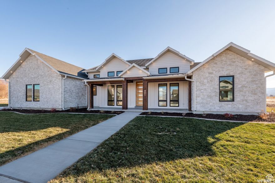 Ready for a home that keeps up with your on-the-go lifestyle? This stunning new build features 2  RV garage with  14'x14' doors and a 16' ceiling one is 16x47 the other is 16x43 and a single car bay, providing ample space for all your vehicles and toys. Inside, you'll find a spacious and open layout with an upscale kitchen-perfect for entertaining. The sophisticated owner's suite offers a true escape, complete with a spa-inspired bathroom. This home includes 5 bedrooms. It comes fully finished, including professional landscaping and fencing. PICK YOUR COLERS AND FEATURES. photos are of a previous home with buyers previous buyers color choices.