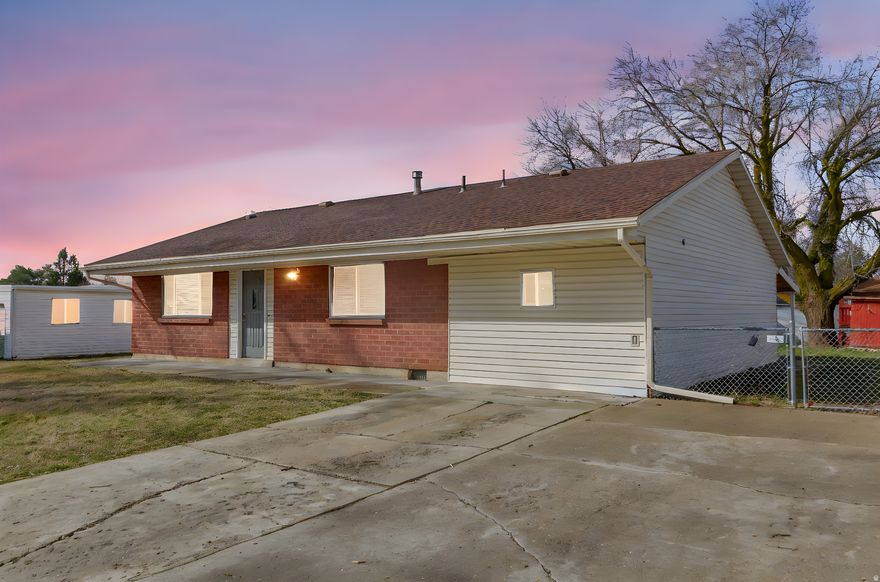 Welcome to this beautifully maintained traditional rambler nestled in one of Ogden's established neighborhoods. This inviting home offers the ease of single-level living combined with classic charm and thoughtful updates. Large windows fill the living spaces with natural light, creating a warm and welcoming atmosphere from the moment you step inside.  The spacious layout features comfortable gathering areas, a beautifully remodeled kitchen with gas stovetop, and generously sized bedrooms. The property offers a large backyard space for room to garden, play, or host summer evenings with family and friends.  Located just minutes from Ogden's vibrant downtown, you'll enjoy quick access to local dining, shopping, entertainment, parks, and year-round outdoor recreation. With nearby trails, mountain views, and easy commuter routes, this home perfectly blends convenience, comfort, and the lifestyle Northern Utah is known for. Also only less than 5 minutes away from Ogden-Weber Technical College and less than 10 minutes away from Weber State University.   This Ogden gem is ready to welcome you home, come see it today!