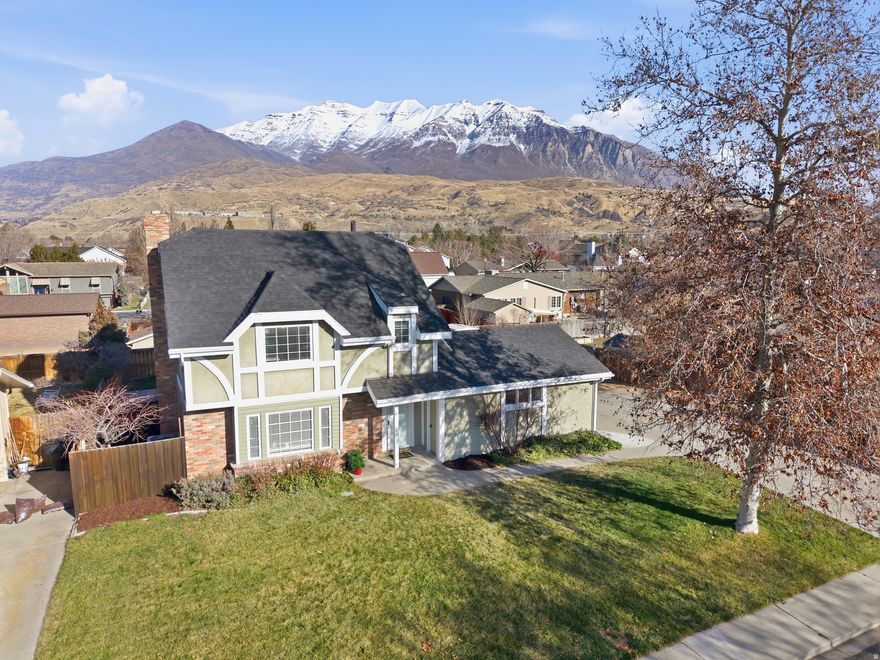Don't miss this charming home nestled in a quaint and quiet Orem neighborhood that includes a basement mother-in-law suite, complete with its own kitchen. If you're looking for rental income, this house fits the bill! This home is full of character that you just don't see in homes these days, including a 3rd floor loft area that offers a spacious bedroom and bathroom. You'll enjoy spending hours outside in the beautiful, fully-fenced yard, that includes a large Trex deck for outdoor entertaining, as well as a hot tub. And those mountain views, they can't be beat!  Conveniently located 3 miles from I-15 and just 15 minutes from Sundance, you'll be able to work and play close to home. Also, there is no HOA!