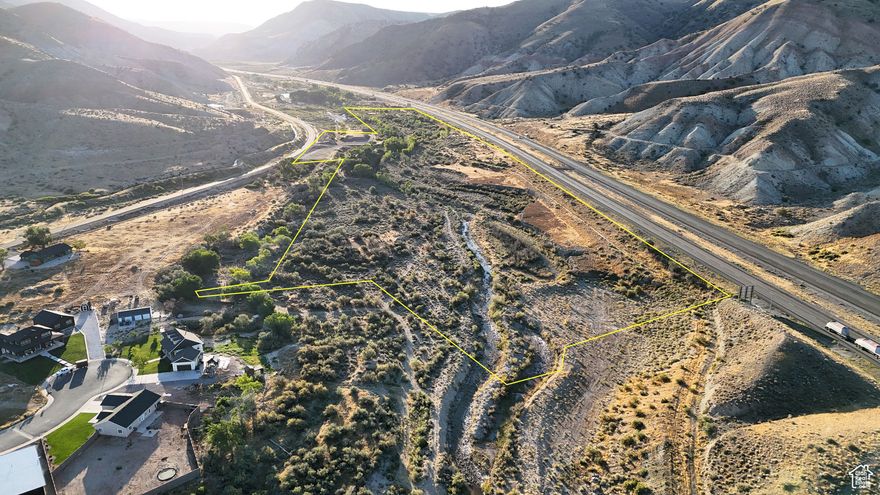 Located just outside the city limits of Salina, Utah, this property combines development potential with natural features and convenient access to both town and recreational opportunities. Positioned between the city park and the city fish pond, the land sits in a location that balances quiet surroundings with quick proximity to community amenities. The parcel has frontage along Old Highway 10, providing paved road access and power availability at the property's edge. Interstate 70 forms the southern boundary, enhancing accessibility while keeping the land situated near key routes in central Utah. Salina Creek flows through the property for more than half a mile, offering year-round water and supporting a corridor of mature trees. The creek provides a natural landscape feature, with wildlife including deer, turkeys, fish, and the occasional beaver observed in the area. Several acres of the land have already been cleared and leveled, offering building-ready ground for homesites or other uses. The property includes more than 4 acre-feet of underground water rights, supporting multiple residential possibilities. This water resource enhances the flexibility of the land, whether for a private residence, multiple homesites, or future development. Within walking distance, the Salina city park complex and fish pond provide convenient recreation. Services, including groceries, fuel, restaurants, and the post office, are only a short drive away. At the same time, the property lies less than two miles from the boundary of Fishlake National Forest. The area offers access to the Piute ATV Trail system, Gooseberry Campground, and the Great Western Trail, making it an ideal location for those who value outdoor recreation alongside town access. The property's elevation averages 5,270 feet, with a mix of cleared building sites, creekside tree cover, and views of surrounding mountain ranges. The location places it in the center of Utah, with quick connections to both local resources and regional recreation. Salina is the closest community, offering essential services within minutes. Richfield, approximately 20 miles to the southwest, provides expanded shopping, healthcare, and schools. Provo lies about 90 miles north, while Salt Lake City is about 140 miles from the property. This parcel presents opportunities for development or personal use, combining natural features like Salina Creek and mature trees with water rights and infrastructure access. Its balance of location, resources, and recreational opportunities makes it a distinctive option for buyers seeking land in central Utah.