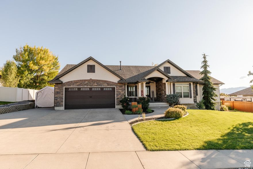 HUGE PRICE REDUCTION!!! MOVE IN BEFORE CHRISTMAS!!! BRAND NEW EXTERIOR PAINT, NEW CARPET THROUGHOUT,  PAID OFF SOLAR AND AN AMAZING BACKYARD ARE JUST A FEW HIGHLIGHTS THAT MAKE THIS 5 BED 3 BATH RAMBLER AN ABSOLUTE MUST SEE. This beautiful home offers the perfect blend of comfort and functionality. Located in a wonderful neighborhood, on a quiet street, near parks, schools and the mountains. This home has ample space and upgrades throughout. As you enter the home, you are greeted by a spacious entryway that leads into the heart of the home-a large kitchen with vaulted ceilings and plenty of counter space and storage, perfect for cooking and entertaining. A cozy dining area adds to the flow and convenience of the main living space. There is also plenty of space for a large dining room or additional family room. So many options to be able to customize this home to fit your needs. The oversized family room offers a welcoming space to relax, visit or cozy up by the fireplace. The main floor also features a luxurious primary suite, providing the ultimate comfort and privacy. The updated ensuite bathroom boasts double sinks, a steam shower with built-in lights, radio, jets, and a waterfall shower head. You'll also find a large soaker tub, making this bathroom a true retreat. For added convenience, the main floor includes a spacious laundry room with a sink and long countertop as well. Downstairs, you'll find a spacious living area-perfect for movie nights, a playhouse that the little ones will love, there's even room for a home gym and pool table as well. Two additional bedrooms and a full bath complete the lower level, offering both comfort and space for guests or growing family needs with two water heaters and a water softener. Outside you will love the expansive .37 acre yard, an entertainer's dream. The X-large covered patio is perfect for hosting family and friends, while the fire-pit, inground trampoline, fruit trees, garden boxes, and garden shed provide endless opportunities for outdoor fun and hobbies. This home also has solar panels that are paid off for a minimal electrical bill. It truly has it all; space, style, efficiency and an incredible yard. Don't miss this opportunity to make this gem your own! Square footage figures are provided as a courtesy estimate only and were obtained from county records. Buyer is advised to obtain an independent measurement.