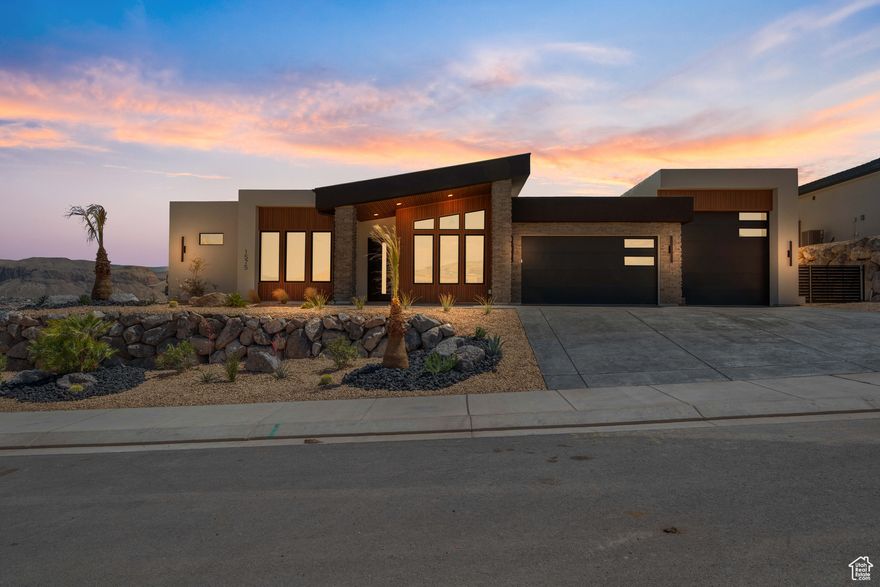 Impressive and thoughtfully designed, this 4 bed, 4 bath home features vaulted ceilings, expansive windows, and luxury finishes- appraised at $1,075,000. The modern kitchen includes walnut and charcoal cabinetry, slab backsplash, premium appliances, and a large pantry. Crisp tile, engineered hardwood, and a gas fireplace enhance the elegance. The primary suite offers floating cabinetry, a freestanding tub, backlit mirror, and custom closets with laundry hookups. Extras include 8' doors, Moen fixtures, dual water heaters, RV garage with hookups, epoxy garage floors, and stamped concrete. No HOA. Large backyard turf area with desert landscaping.