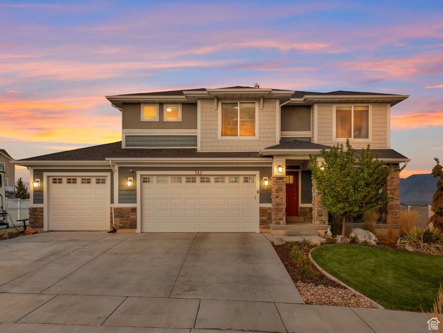 Welcome to Talus Ridge, a friendly, tight-knit community on the north end of Saratoga Springs where neighbors connect, kids play at the park across the street, and the annual Fourth of July fireworks rival the city's display.  This beautiful two-story home offers 3,459 square feet with 4 bedrooms and 2.5 bathrooms, set on a spacious 0.324-acre lot,  one of the largest in the neighborhood. Step inside to a bright, open layout that's both comfortable and functional, featuring a large living area with vaulted ceilings that flows into a modern kitchen with white cabinetry, stainless steel appliances, and a generous island perfect for gathering.  A standout feature of this home is the custom-built office, complete with beautiful built-ins, perfect for working from home, relaxing with a good book, or displaying your favorite collectibles.  Smart-home upgrades include smart lighting, thermostats, and doorbell, combining convenience and efficiency. The oversized lot offers space to create your dream outdoor retreat.  Residents of Talus Ridge enjoy two neighborhood parks and a close by dog park, all within minutes of shopping, dining, and entertainment. With quick access to the new Mountain View Corridor, commuting is simple and convenient.  Lovingly maintained, this home is move-in ready and waiting for its next chapter.