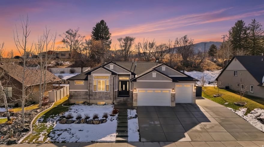 Charming Single-Family Home at the Mouth of Wellsville Canyon in Cache Valley, UT! Discover your new sanctuary nestled at the entrance of Wellsville Canyon in a serene and beautiful subdivision. This meticulously maintained single-family home, boasts a fully finished interior, perfect for your immediate comfort. Set against the stunning backdrop of the Wellsville Mountains, this home features a breathtaking backyard, adorned with lush landscaping and mature trees, RV parking, over-sized garage and more! It's an ideal setting for enjoying the sights and sounds of wildlife that often grace the neighborhood. Your private oasis includes exquisite landscaping, a basketball court, a secluded patio, and ample shade for delightful outdoor dining and entertainment. Step inside to find soaring high ceilings and a cozy rock fireplace that adds warmth and character to the living space. The kitchen is a chef's delight with a charming pop-out dining area, gas stove, double ovens, custom venting, natural hickory wood floors, and a spacious walk-in pantry. The luxurious primary bedroom offers high ceilings and large windows, accompanied by expansive walk-in closets, soaking tub, separate shower, and double sinks designed for ultimate convenience. The fully finished basement is perfect for entertaining, featuring additional bedrooms and a mini kitchen, making it an ideal space for games, parties, and cozy nights in. This home is truly move-in ready, offering both comfort and style. Don't miss your chance to own this gem-contact Tracy Duncan with Equity Real Estate for a private showing today!