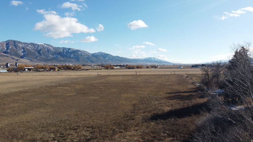 4.73 Acres  Prime Residential Land in Malad City, Idaho  Discover the perfect setting for your dream home on this beautiful 4.73-acre parcel located just outside the city limits of Malad. Situated on Samaria Lane, this residentially zoned property offers privacy, space, and flexibility - ideal for a private estate or potential division into two single-family dwellings (buyer to verify division potential with Planning & Zoning).  Enjoy stunning, panoramic views of the surrounding Malad Valley, offering wide-open skies and picturesque mountain backdrops in every direction.  The land includes valuable groundwater rights with beneficial use designated for irrigation. Currently planted in alfalfa, the property is fully fenced and ready for continued agricultural use, livestock, or future development.  Experience peaceful rural living with convenient access to town amenities. Whether you're looking to build your custom home, create a small homestead, or invest in development potential, this property offers outstanding opportunity in a highly desirable location.