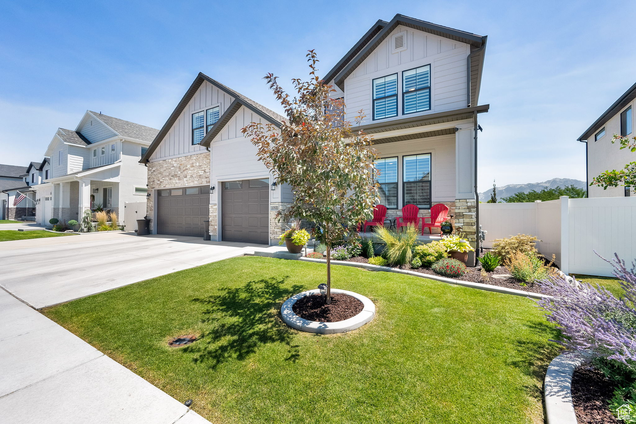 Breathtaking mountain views and thoughtful upgrades make this home truly one-of-a-kind. From your fully landscaped, maintenance-free backyard, enjoy uninterrupted year-round views of the Wasatch Mountains. The west-facing orientation melts snow in winter while providing shaded comfort for summer entertaining on the covered patio. Inside, timeless design blends with modern convenience. The kitchen features white cabinetry, quartz countertops, subway tile backsplash, double ovens with a gas range, and a spacious pantry that can be converted to a butler's pantry. Luxury vinyl plank flooring, wood and faux plantation shutters, custom wood accent walls, designer lighting, and a herringbone fireplace surround add warmth and style throughout. Built-in shelving, organized walk-in closets, and a versatile bonus room-perfect as a 5th bedroom or home office-offer both function and flexibility.