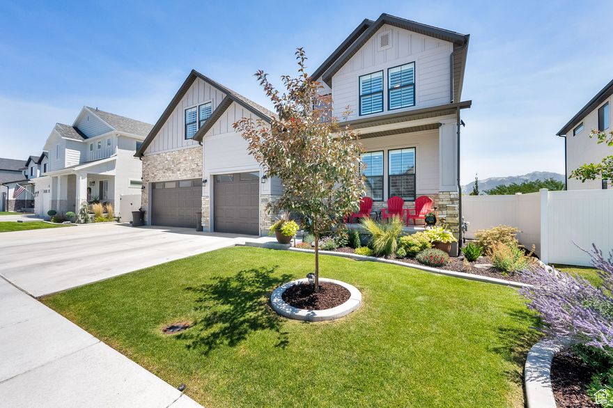Breathtaking mountain views and thoughtful upgrades make this home truly one-of-a-kind. From your fully landscaped, maintenance-free backyard, enjoy uninterrupted year-round views of the Wasatch Mountains. The west-facing orientation melts snow in winter while providing shaded comfort for summer entertaining on the covered patio.  Inside, timeless design blends with modern convenience. The kitchen features white cabinetry, quartz countertops, subway tile backsplash, double ovens with a gas range, and a spacious pantry that can be converted to a butler's pantry. Luxury vinyl plank flooring, wood and faux plantation shutters, custom wood accent walls, designer lighting, and a herringbone fireplace surround add warmth and style throughout. Built-in shelving, organized walk-in closets, and a versatile bonus room-perfect as a 5th bedroom or home office-offer both function and flexibility.