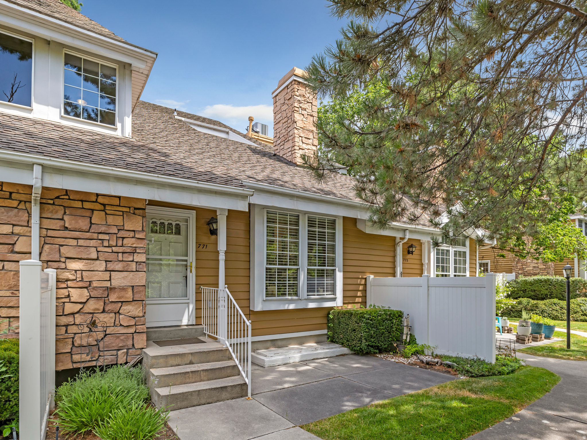 Exterior facade featuring stone veneer and horizontal siding