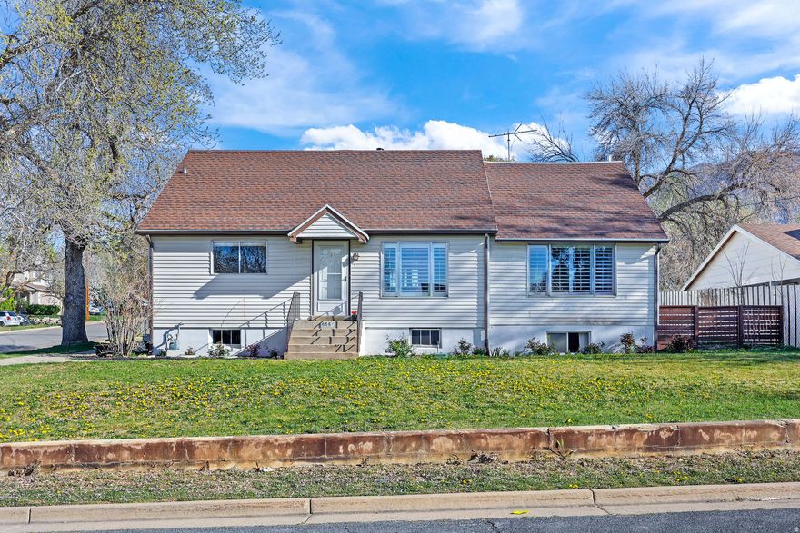 Discover a home designed for flexibility and potential, offering a unique layout that features two bedrooms on the main level and a large living room that opens directly to the backyard for a seamless indoor-outdoor flow. The upper-level addition serves as a true private retreat, complete with a spacious bedroom, a full bathroom, and its own private balcony for quiet mornings. For year-round comfort, modern mini-split A/C units provide efficient, zoned climate control on both levels, while the full basement offers a large family room and abundant storage space. As an added bonus, all updated kitchen appliances are included.  Situated on a large corner lot, making it a functional paradise for hobbyists and gardeners alike. A detached two-car garage features a dedicated, attached shop with an internal pass-through door-the perfect setup for woodworking or year-round projects. You will love the exterior's mature shade trees, the fenced garden area with raised beds, a charming chicken coop, and a solid secondary storage shed. This home is easy to show and ready for your personal touch; come see it today!