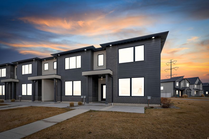 HUGE OPPORTUNITY FOR INVESTOR OR BUYER!! MODEL TOWNHOME FULLY FURNISHED!!  Located minutes from the Front Runner station, this end unit is ideal for buyers looking for low-maintenance living or as a fully furnished rental unit. The open-concept main floor features a spacious living area and a modern kitchen designed for both everyday living and entertaining with  natural light throughout. Upstairs, you'll find a versatile loft space - perfect for a second living room, home office, play area, or workout space. The large primary suite includes a private ensuite bathroom and large walk-in closet. Residents enjoy access to outstanding community amenities, including a swimming pool, pickleball courts, basketball court, and neighborhood park - offering built-in recreation just steps from home. Conveniently located near shopping, dining, schools, and commuter routes, this move-in-ready townhome checks every box. Don't miss your chance to own this perfect home in the heart of American Fork! FULLY FURNISHED PRICE IS $499,900, including TVs, appliances, beds, chairs, tables--EVERYTHING! Schedule your showing today!