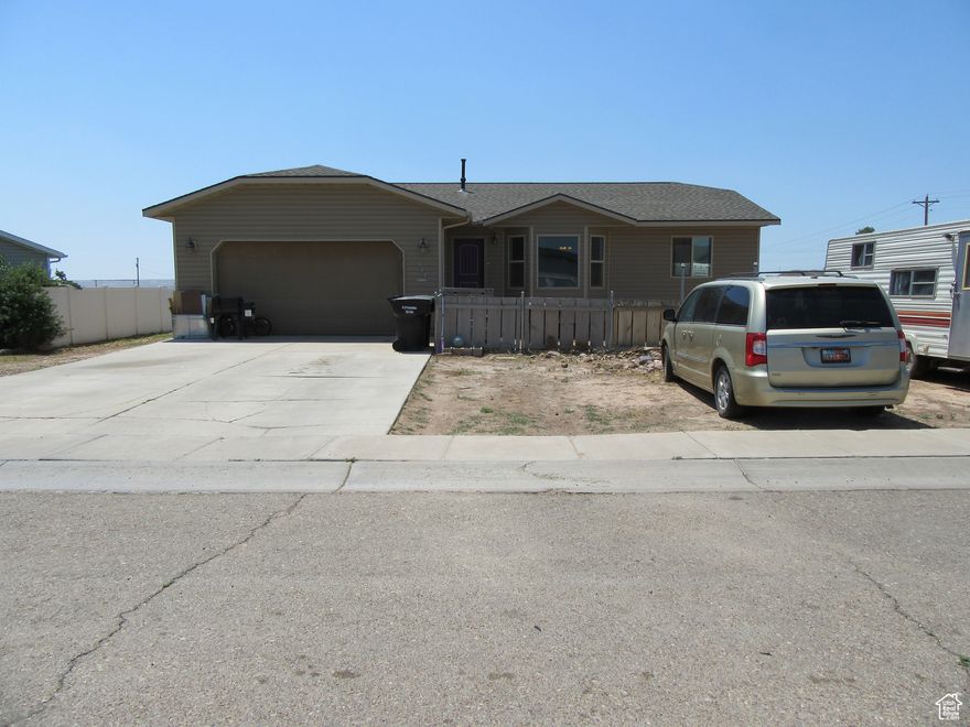 ***PRICE IMPROVEMENT***  This 3200+ sq ft home offers 6 bedrooms, 3 bathrooms (1 is partially finished), 1 bonus room that could be used as an office or open it up into the adjacent bedroom and make a huge walk-in closet.  (the room has no window) .  This home sits in a quiet cul-de-sac.  The front yard has a sprinkler system and will need little soil and  seed or sod. The back has neither.   The owners have completed most of the basement and there is sheetrock to work on the remaning areas.  The home needs a little TLC so the owner is still offering $15,000 with a full price offer, for flooring and other things that need to be worked on such as some mud & tape in the basement, base boards, flooring, paint, toilet, tub (all in the basement).  The upstairs was recently painted,  There is an on demand hot water heater and blown in insulation, helping with energy costs.  There is a school bus route for all three schools. Bring your vision and dreams to life!   If you love the outdoors, this home is situated near some great areas.  It's only about 36 miles from Starvation Reservoir, 84 to Strawberry Reservoir, 46 to Dinosaur National Monument, 31 to Vernal, 68 to Flaming Gorge, 75 to the Uinta mountain range. Roosevelt has a temporary halt on building permits due to water shortage concerns so this would be the time to get into an existing home here!  Don't miss your chance to own this great family home at this price and instant equity!! Measurements are provided as a courtesy only.