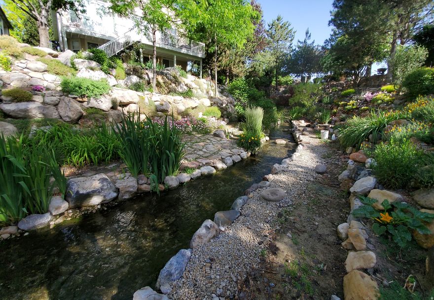 This rambler has it all! 2 master suites, large open family room with fireplace and dining area that has an amazing mountain view. Walk-out basement with bedroom, bath, large family room, wet bar, perfect for entertaining or having another private living area. All of the big items replaced within the last 1-6 years, roof, furnace, air. Solaar paid for. HOA covers outside water for sprinklers, all landscaping maintenance, snow removal, trash. Situated on a corner lot that backs up to a beautiful creek.