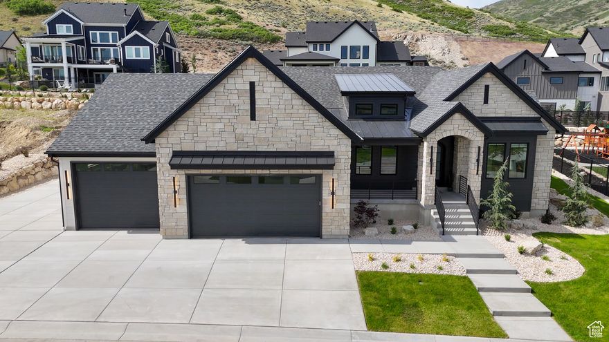 Featured home is built by award winning builder, Sage Homes, located in the luxurious gated community of Step Rock Estates in Herriman. This home features 10 ft. main level ceilings, with a 12 ft. ceiling in the Great Room, 15 ft. ceiling in the front Office & a 10 ft. foundation. This home is BUILT & PRICED to sell!! The main level features a large entertaining space, a large primary suite along with a full guest suite. From the dining room you walk out to a large a 17 x 15 covered deck that attaches to an 18 x 15 concrete patio that is perfect for grilling, relaxing & entertaining, no matter what time of the year. The Basement features a 10' Foundation height with a fully finished kitchenette area, 3 bedrooms & a storage or gym area. You also have a separate entrance to the basement that can be accessed through the 3rd car garage. The garages are a major feature of their own with the 3rd Car Garage being 15 x 43, making it a true 4 car garage with more than enough space for extra storage. Additional features of this home include: Chef's Kitchen w/ Monogram Appliances, Metal Railings, Oversized 2 & 3 Car Garages, Quartz Countertops throughout with a 10 ft. Kitchen Island, Basement Entrance, Modern Exterior plus much more!