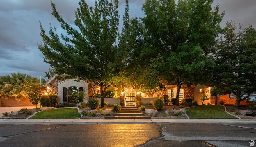 Beautiful home located in the quiet and secluded Cox Landing neighborhood near the heart of St George. The gourmet kitchen features high-end custom cabinetry, thick granite countertops, a gas cooktop with a wood hood and pot filler, and wall ovens. The spacious primary suite offers a roll-in steam shower with double shower heads, jetted tub, and a large walk-in closet with a stackable washer/dryer. The studio ADU has an exterior door, vaulted ceilings, a kitchenette, full bath, and a walk-in closet. Enjoy multiple gathering spaces, including a large basement family room with a kitchenette. The backyard features a saltwater pool with fountain, hot tub, outdoor kitchen with BBQ and TV, gas fire pit, and 2 covered patios surrounded by palm trees and mature landscaping.