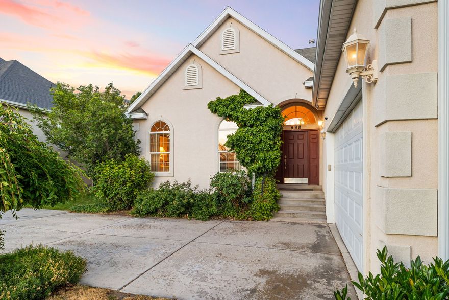 UNREAL VIEWS OF MOUNT TIMPANOGOS is not the only thing that makes this rambler a showstopper: Highly Desirable neighborhood, Single ownership, Great Layout, 2 Kitchens, 2 Laundry Rooms, 2 Living Rooms, and 3 fireplaces... and priced to sell! Set at the base of Mt. Timp with the dreamiest backyard views (no backdoor neighbors!), this gem is overflowing with charm and opportunity. Inside, the layout makes sense, with three bedrooms on the main level, including a spacious Primary Suite with a fireplace, large walk-in closet and roomy bathroom! Downstairs, you'll find two more bedrooms, an extremely large second living room, and a fully functioning second kitchen--ideal for hosting, hobbies, or whatever life throws your way. Functionality reigns supreme with laundry rooms on both the main level and in the basement, along with tons of storage (cold storage & regular storage room(s)), AND AN ADDITIONAL framed, unfinished room ready to become a home gym, extra storage room, or a 6th bedroom. BONUS: UPDATED HVAC, WATER HEATER, ATTIC INSULATION FOR EFFICIENCY, AND PAD/ELECTRICAL FOR GENERATOR!  The backyard feels like a little retreat, with fruit trees (cherry, apple, blackberry), mature shade, and that rare combination of being both spacious and quaint at the same time. This home has been deeply loved over the years--and you can really tell. Don't miss out!
