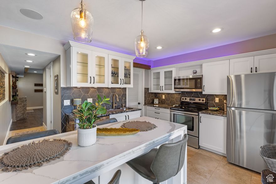 Welcome to your one of a kind home in the heart of Salt Lake City! This impeccably remodeled condo blends modern design with comfort and sophistication. Every detail has been thoughtfully curated, from the custom kitchen with quartz and granite countertops to the luxurious, spa-like primary bathroom. Perfectly situated, this home offers unmatched convenience just steps from premier dining, shopping, parks, and entertainment. For commuters and outdoor lovers, enjoy easy access to Parleys Canyon, I-15, and I-215, making travel to ski resorts and downtown effortless.  Square footage figures are provided as a courtesy estimate only and were obtained from tax data. Buyer is advised to obtain an independent measurement.