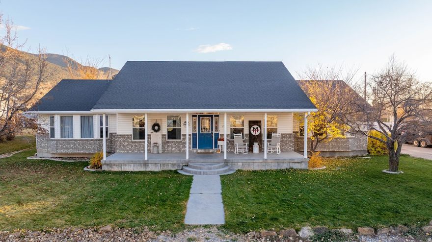 Set on a spacious half-acre in the heart of Manti, this well-kept 5-bed, 2.5-bath home offers more than 4,000 sq. ft. of inviting living space. The main level features an open layout connecting the kitchen, dining, and living areas, creating an easy flow for daily living or hosting. Large windows and a bright sunroom bring in abundant natural light and provide a quiet spot to unwind year-round.  The primary bedroom is generously sized and includes a large ensuite bathroom with a walk-in closet, offering plenty of storage and a comfortable retreat. Upstairs, the living room centers around a gas stove, while the basement features a spacious second living area warmed by a wood-burning stove. All additional bedrooms offer flexible space for family, guests, or home offices. A roomy cold storage area adds even more functionality.  A standout feature of the property is the attached grooming shop/hair salon complete with its own half bath, ideal for a home business, hobby space, or creative studio.  Outside, the yard feels like a private retreat with mature trees, thoughtful landscaping, and room to garden, entertain, or simply enjoy the peaceful surroundings. The location provides quick access to the Manti Temple, local schools, Palisade State Park, and outdoor recreation.    Square footage figures are provided as a courtesy estimate only and were obtained from County Records.  Buyer is advised to obtain an independent measurement.