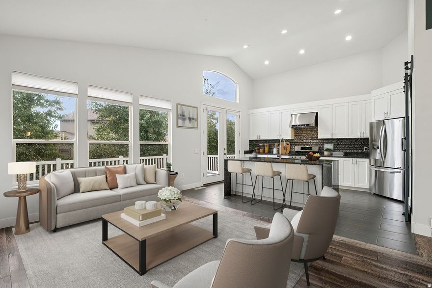 Enjoy coming home to this fully remodeled 4-bedroom, 3-bathroom home located in the gated community of Renaissance at Trimble Creek. The neighborhood sits along the Jordan River with an excellent public golf course, River Oaks, at the base of the street. The home offers quick access to I-15, Salt Lake City's main artery. Home Depot, Smith's Supermarket, and a host of shops and restaurants are located just minutes away on 9000s and Redwood Road. The home was re-imagined in 2020 as an open concept, with a larger kitchen, custom white European-style cabinets, stainless steel Wi-Fi-ready LG appliances, Nest Home Thermostat, electronic doorbell, luxury granite countertops, a walk-in pantry with a vintage reclaimed wood barn door, matching LVP flooring, and an LED fireplace. Super premium 80oz plush carpet was installed in the master bedroom and basement, making for a very comfortable living experience. Vaulted ceilings, wonderful open great room, spacious bedrooms, main floor laundry room, main floor office/4th bedroom, and floor-to-ceiling windows throughout offering excellent privacy and quiet at night. Enjoy the hidden main floor master suite with a newly finished master bathroom, dual floating vanities, a Walk-in closet, and a large euro glass shower. The large Basement offers a wonderful open family room with a walk-out basement. One bedroom with backyard access, 1 full bathroom, potential build-out for another bedroom or shop space, and lots of storage. This gorgeous garden-like home is set next to Trimble Creek and has a private deck with spectacular views of the Wasatch Mountains, with Snowbird ski area and Mount Timpanogos visible. A lower back patio, large 2-car garage with a newly painted floor, and a beautifully manicured yard make this a turnkey, move-in-ready home. Centrally located to schools, shopping, and freeway access. A must-see!