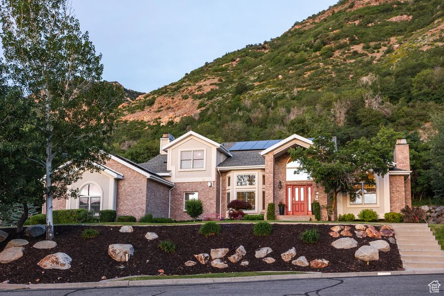 Tucked away in a quiet cul-de-sac and bordered by the Wasatch Forest Service and Bonneville Shoreline Trail, this stunning contemporary home offers a distinctly modern and comfortable feel. With 6 beds, 5 baths, and more than 6,000 square feet of thoughtfully designed living space, this is a home that will see you through every season of life. Built in 1993, the property features soaring vaulted ceilings in the great room, skylights in the family room, and seamless indoor-outdoor living (more on that in just a minute). The updated chef's kitchen is a showstopper-equipped with premium Wolf appliances, a large island, and hood venting to the outside, things flow seamlessly into the dining and family rooms, creating the perfect space for everything from catered parties to formal dinners and late-night, fireside chats. From here, a wall of expansive windows frames the beautiful hills just behind the home and leads to the first of two decks out back, this one with plenty of room to dine, lounge, and BBQ (the second has an in-ground jacuzzi for nights with a glass of bubbles among the bubbles...sold yet?). Rooms throughout the property are ample and spacious. Closets in the main and second floor bedrooms are all customized, with three of them being walk-in closets. A massive basement lends the perfect area for movie and game nights by the downstairs fireplace. Step outside and you'll find easy access to scenic trails that lead to the iconic Bear Canyon Suspension Bridge-perfect for a morning hike or an evening stroll. Additional highlights here include a heated driveway, 3-car garage, solar panels, and unparalleled proximity to world-class outdoor recreation. Located just 10 minutes from the mouth of Little Cottonwood Canyon, this home offers quick access to skiing, hiking, and biking. All told, a rare blend of space, luxury, and location-this one just might be your gateway to mountain living with modern convenience.