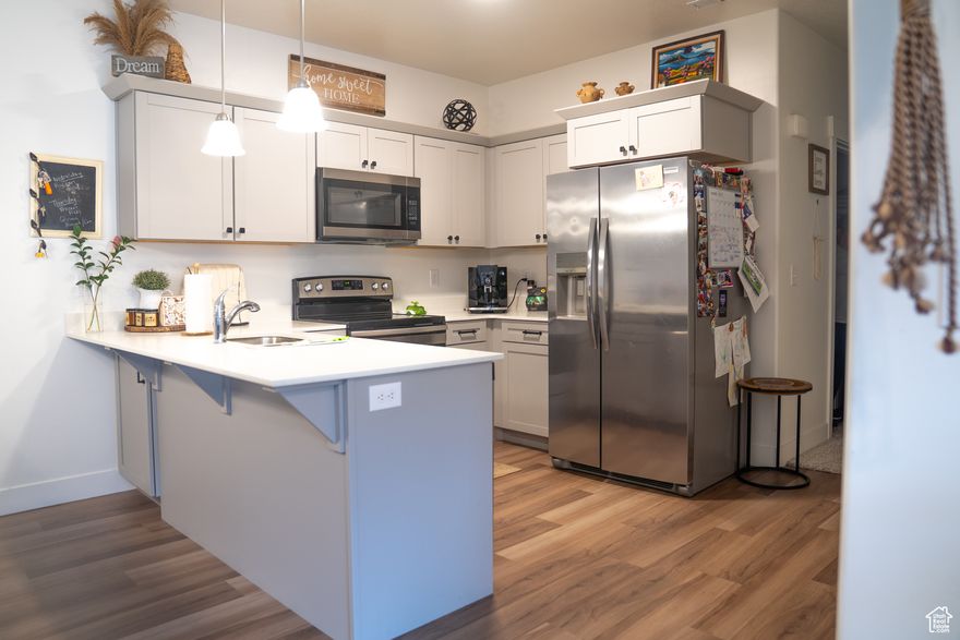 Welcome to this inviting 3-bed, 2-bath main-level condo in Lehi's Timp Point community. Built in 2022, this 1,272 sq ft home offers an open layout with vinyl flooring, a modern kitchen with gas range and dishwasher, and a spacious great room. The primary suite features a walk-in closet and private bath. Enjoy central A/C, high-efficiency furnace, and a private patio. Includes a detached 1-car garage and access to a clubhouse, pool, and playground. Just minutes from schools, parks, and Traverse Mountain shopping.  Square footage figures are provided as a courtesy estimate only and were obtained from County Records .  Buyer is advised to obtain an independent measurement.